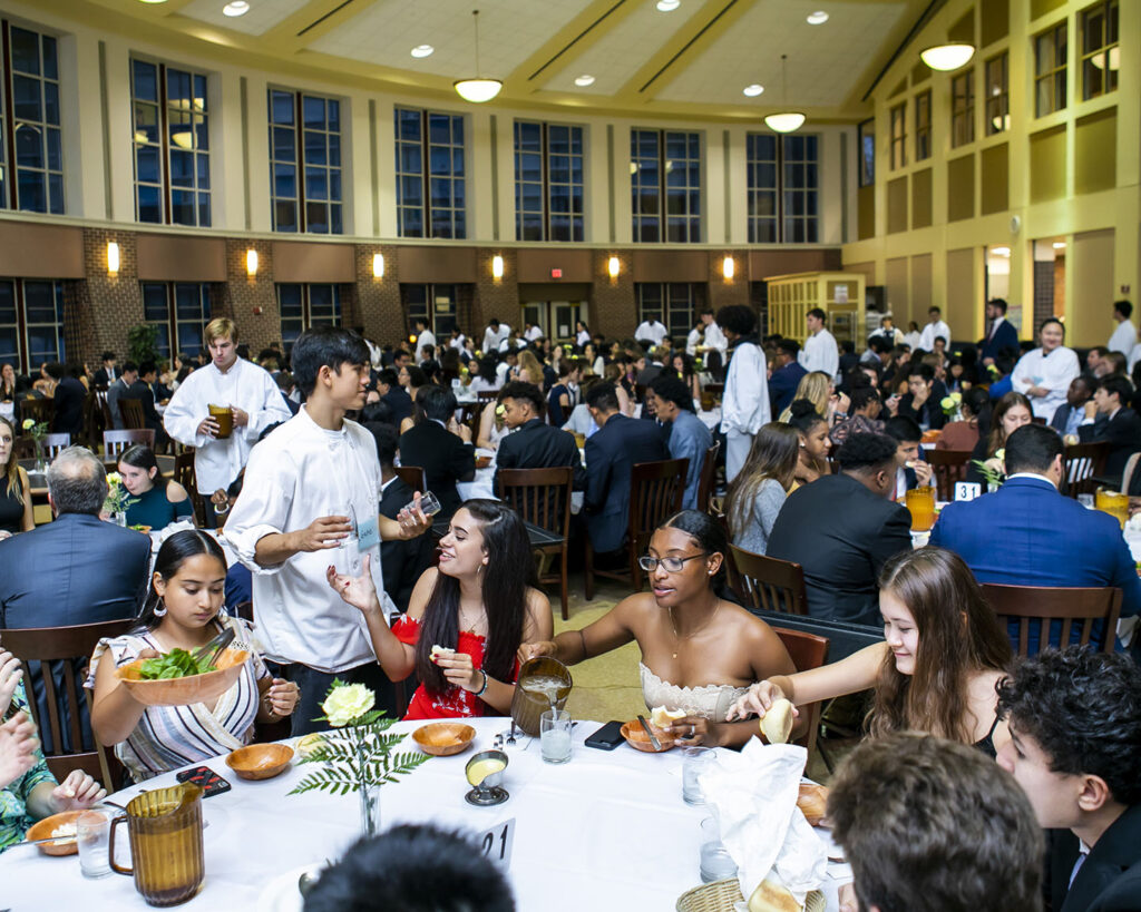 Students sharing Family Style Dinner in the dining hall