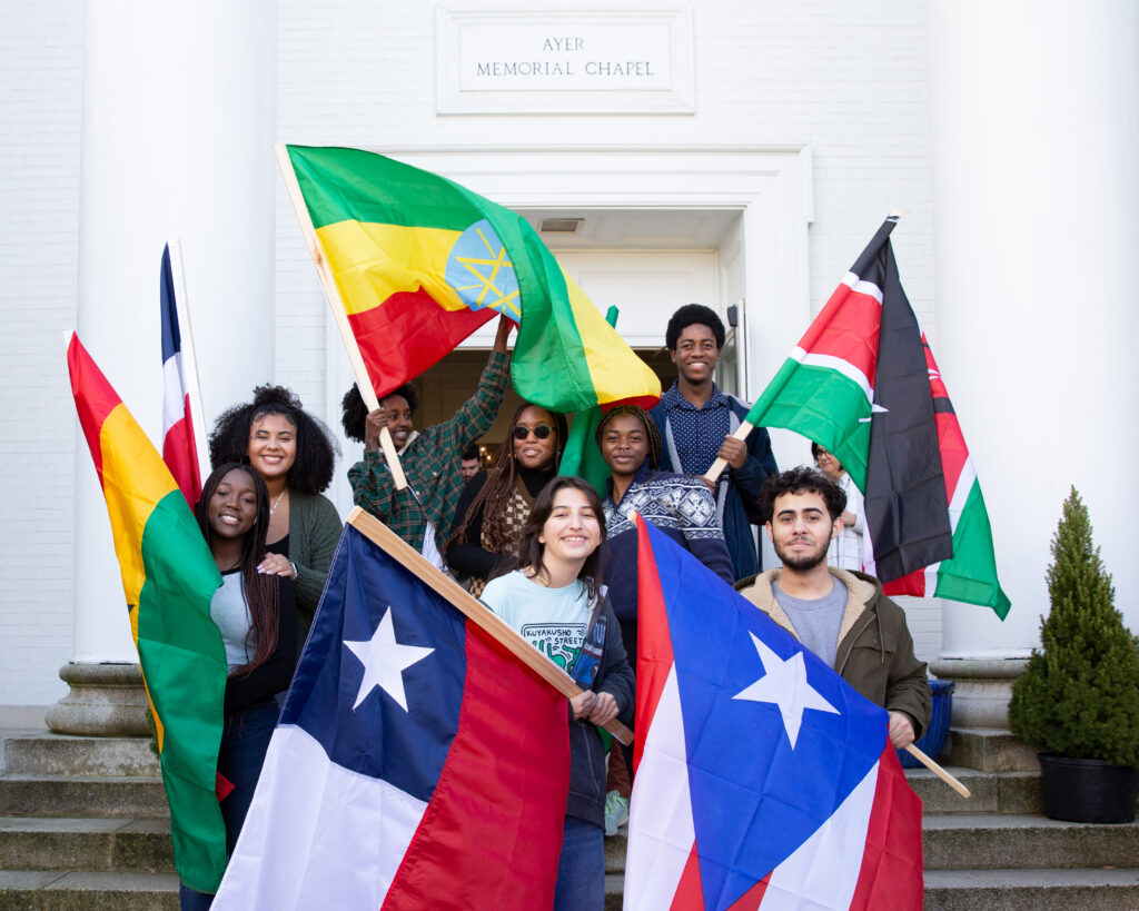 Students posing with flags for Language and Culture Week